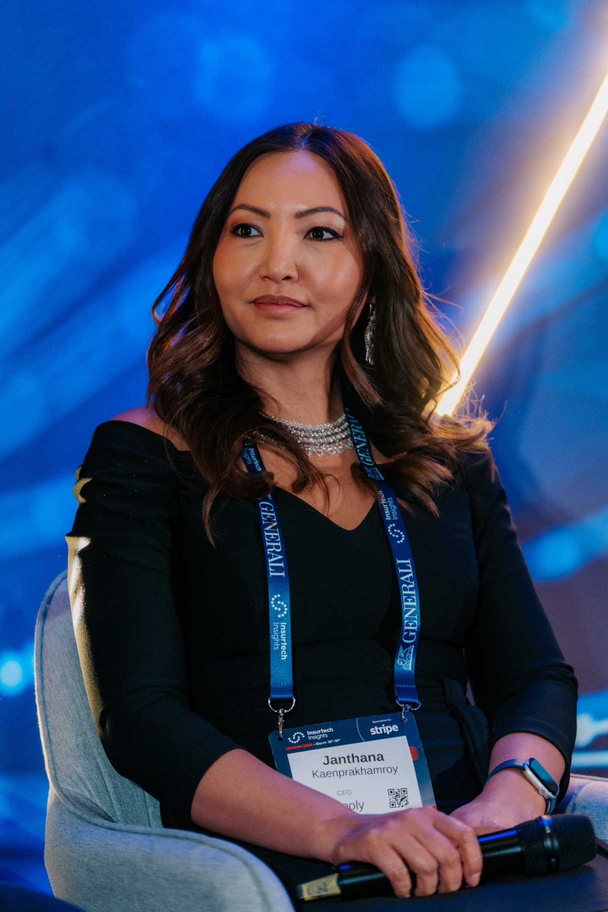 Janthana Kaenprakhamroy speaking on stage at Insurtech Insights
