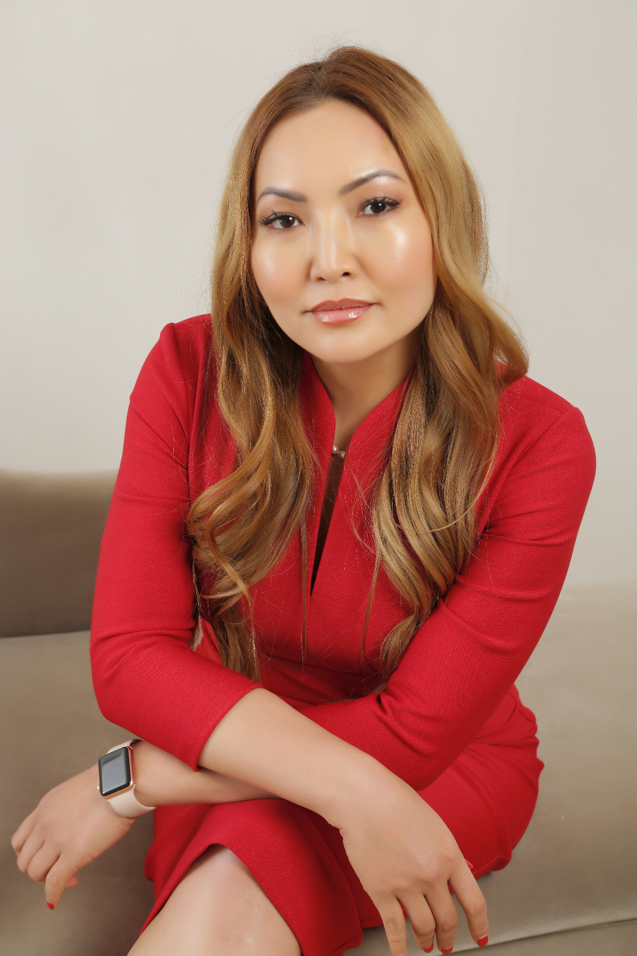 Janthana Kaenprakhamroy seated in a red dress